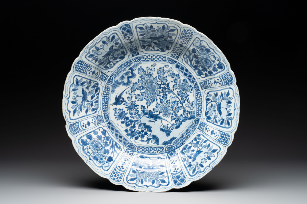 A large Chinese blue and white 'kraak' dish with birds among flowering branches, Wanli