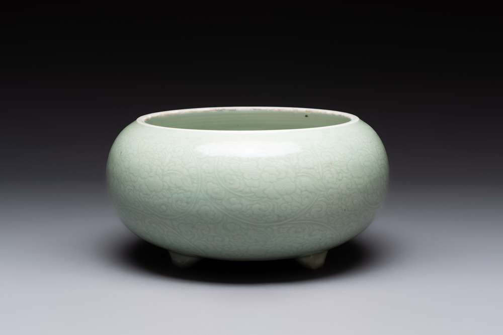A Chinese celadon-glazed tripod censer with 'anhua' floral design, Kangxi