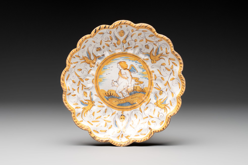 A polychrome Dutch maiolica 'putto and dog' plate, Verstraeten workshop, Haarlem, 17th C.