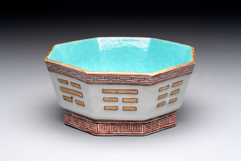 A Chinese iron-red gilt-decorated octagonal 'trigrams' bowl, Tongzhi mark and of the period