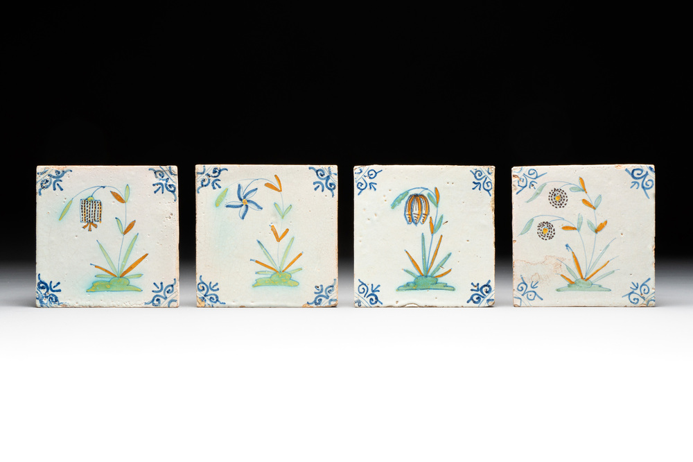 Four unusual polychrome Dutch Delft 'flower' tiles, 17th C.