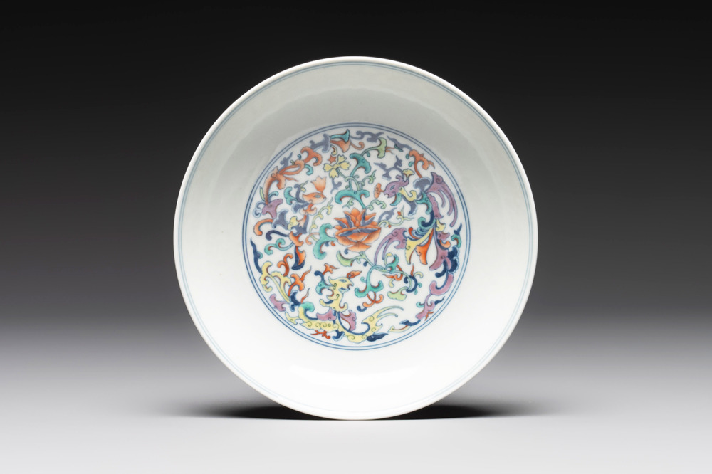 A Chinese doucai 'phoenix and lotus scroll' plate, Qianlong mark and of the period