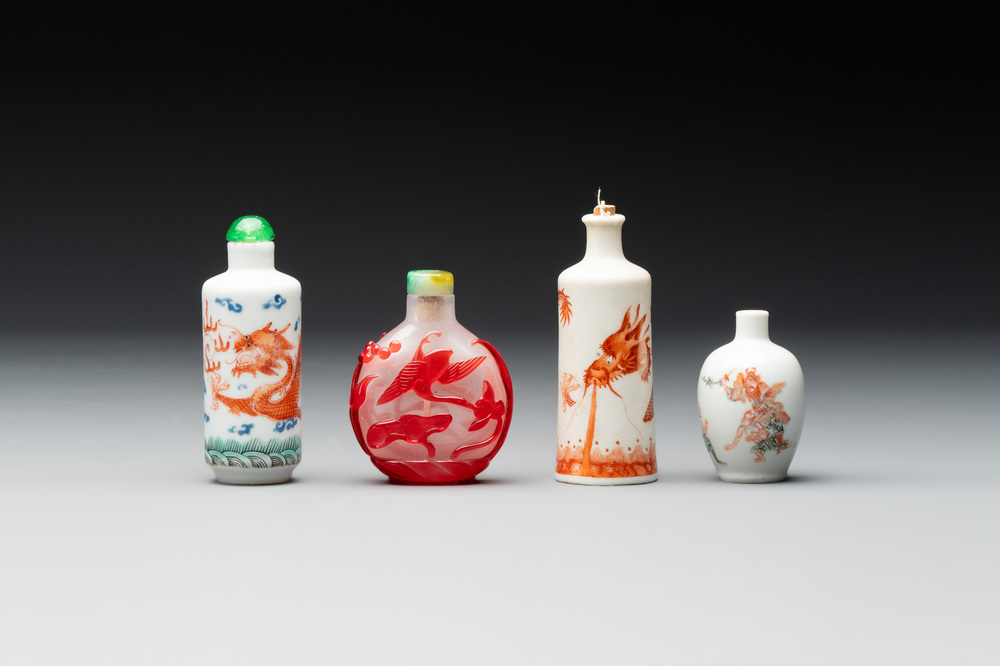Three Chinese porcelain snuff bottles and a red Peking glass snuff bottle, Daoguang and Tongzhi mark, 19th C.