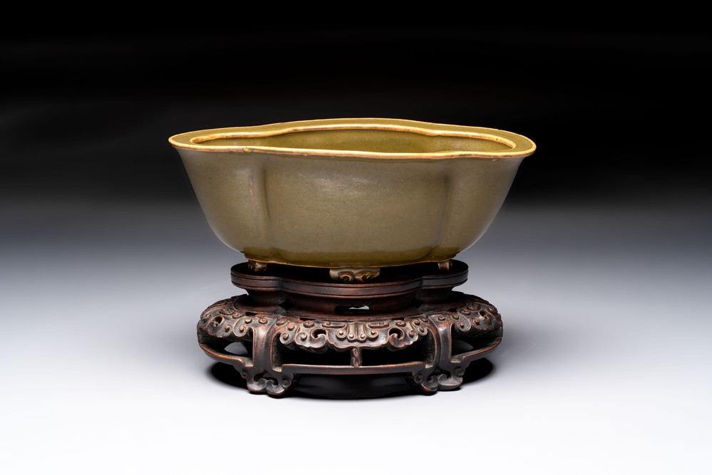 A fine Chinese teadust-glazed quadrifoil jardini&egrave;re with an openworked wooden stand, Yongzheng mark and of the period