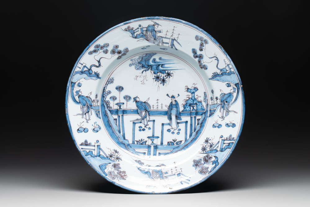 A blue and white 'figures in a garden' chinoiserie dish, Frankfurt, 17th C.