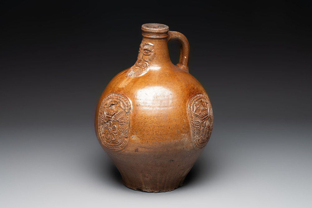 A large brown-glazed stoneware bellarmine jug, 17th C.