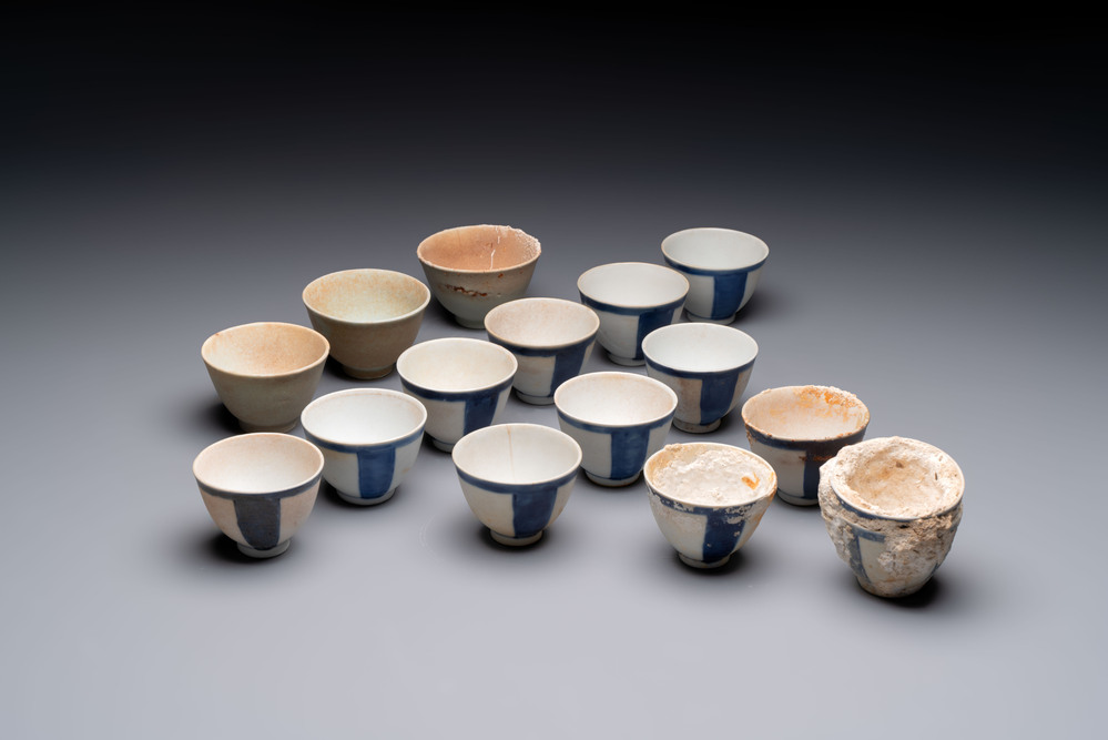 Thirteen Chinese blue and white 'Hatcher Cargo' cups and three celadon-glazed cups, Transitional period