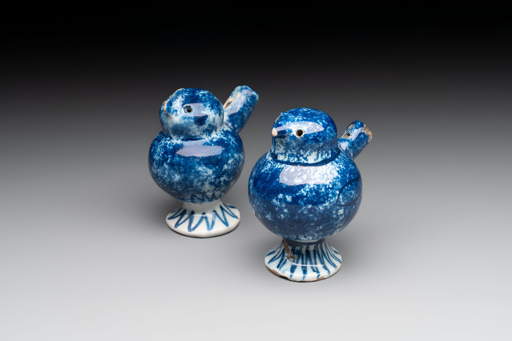 A pair of blue and white Dutch Delft 'bird' whistles, 18th C.