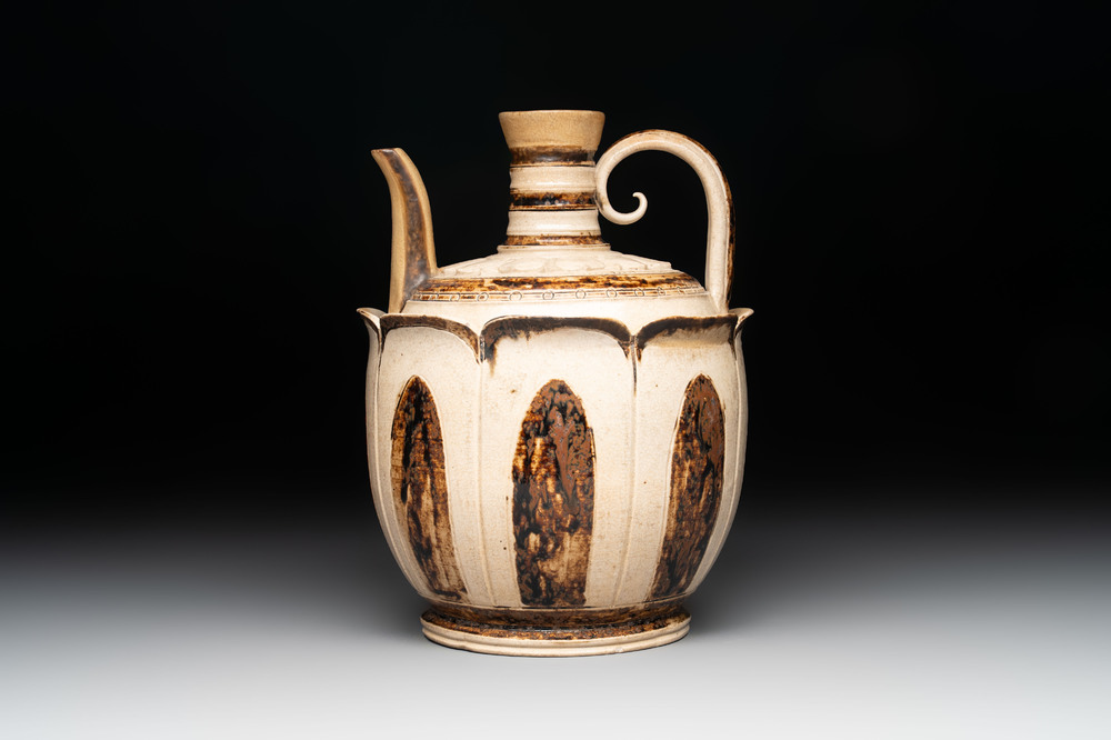 An Annamese or Vietnamese brown-glazed cream-ground 'lotus' ewer, 14th C.