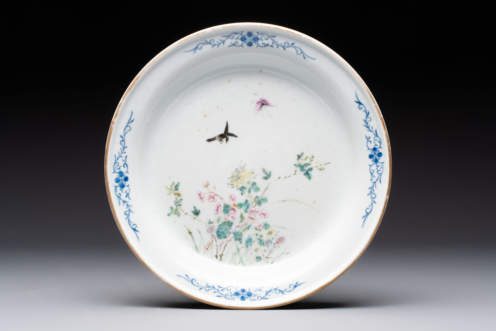 A Chinese famille rose plate with a bird and butterfly among blossoming branches, Yongzheng mark, Republic
