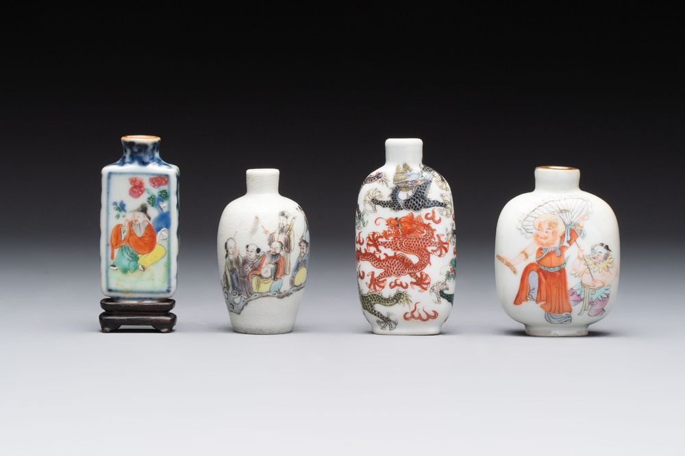 Four Chinese famille rose and verte snuff bottles, dragon and Qianlong marks, 19th C.
