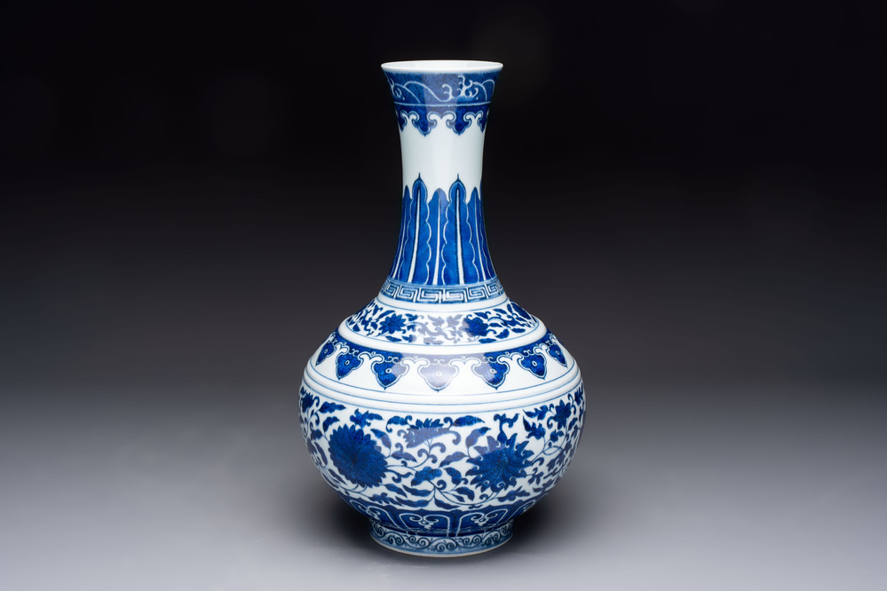 A Chinese blue and white 'flower scroll' bottle vase, Xuantong mark, 20th C.