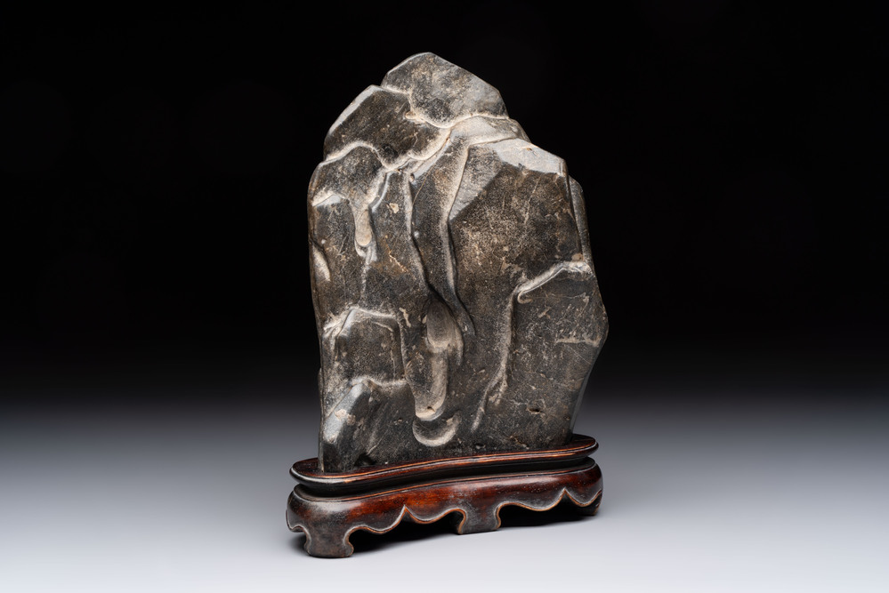 A Chinese Lingbi stone scholar's rock on wooden stand, Yun Tai 雲台 mark, 19/20th C.