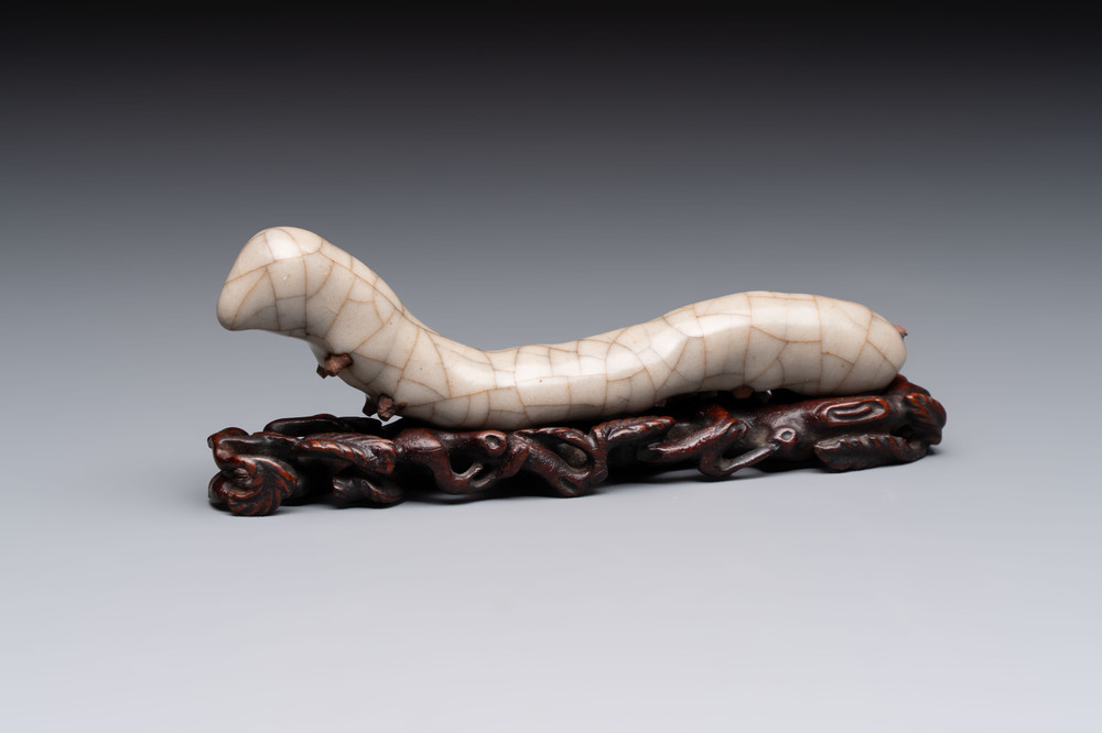 A rare Chinese ge-type model of a silkworm on wooden stand, 18th C.