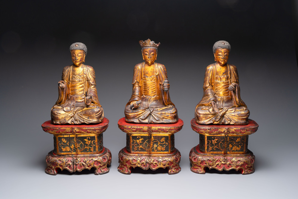 A set of three Chinese or Vietnamese gilt-lacquered wooden sculptures of Buddha, 18/19th C.