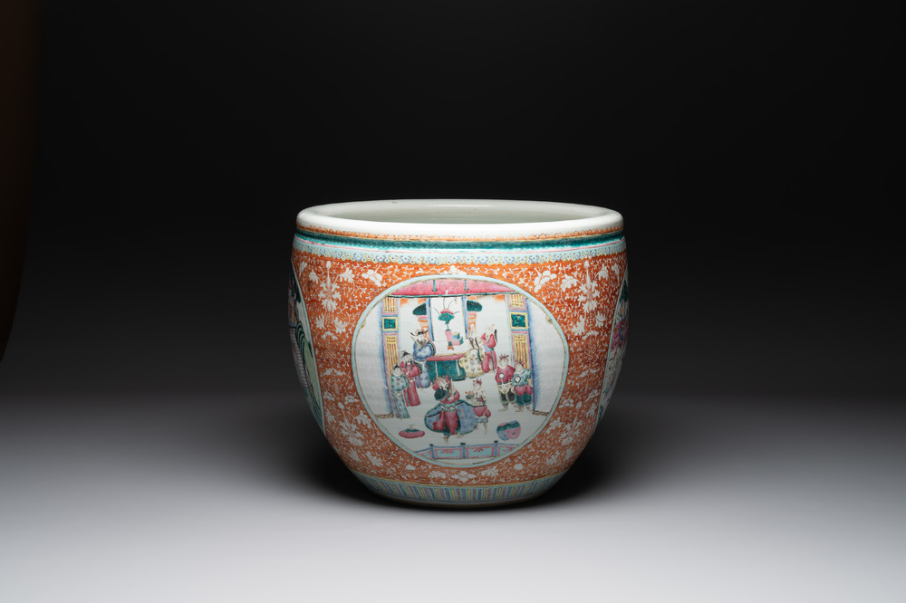 A large Chinese famille rose coral-red-ground fish bowl with narrative design, 19th C.