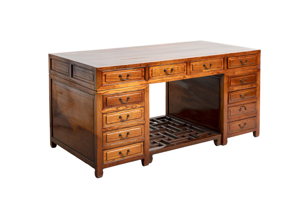 A Chinese wooden desk with drawers and a footrest, 19/20th C.