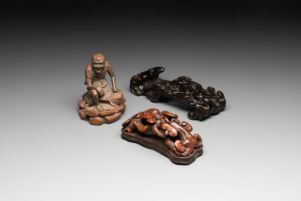 A Chinese bamboo figure of Luohan, a ruyi group on wooden stand and a hongmu stand, 19/20th C.