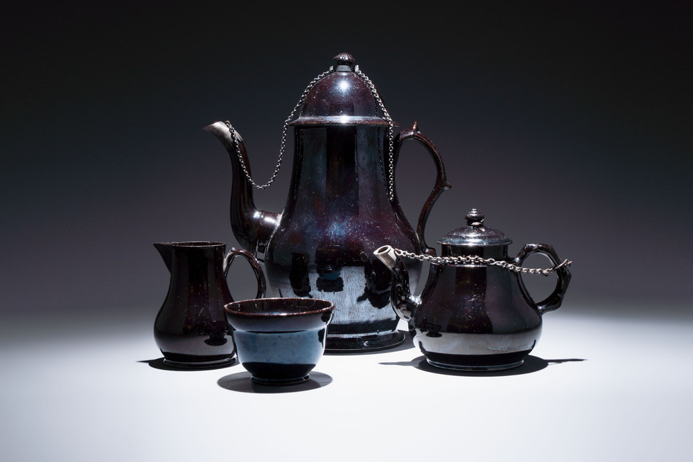 A black-glazed pottery coffeepot, teapot, milk jug and a bowl, Namur, 18th C.