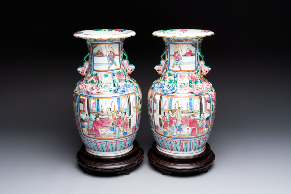 A pair of Chinese famille rose vases with narrative design on wooden stands, 19th C.