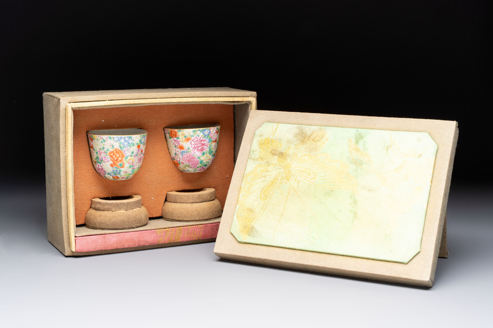 A pair of Chinese famille rose 'millefleurs' cups with a presentation box, Jiaqing mark, Republic