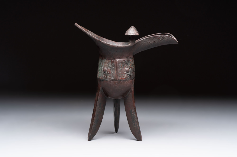 A Chinese archaic bronze wine vessel with taotie design, 'jue 爵', Zhou