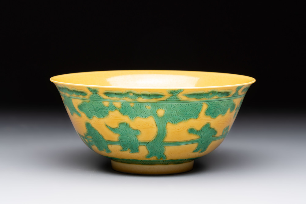 An imperial Chinese green-enamelled yellow-ground 'playing boys' bowl, Yongzheng mark and of the period