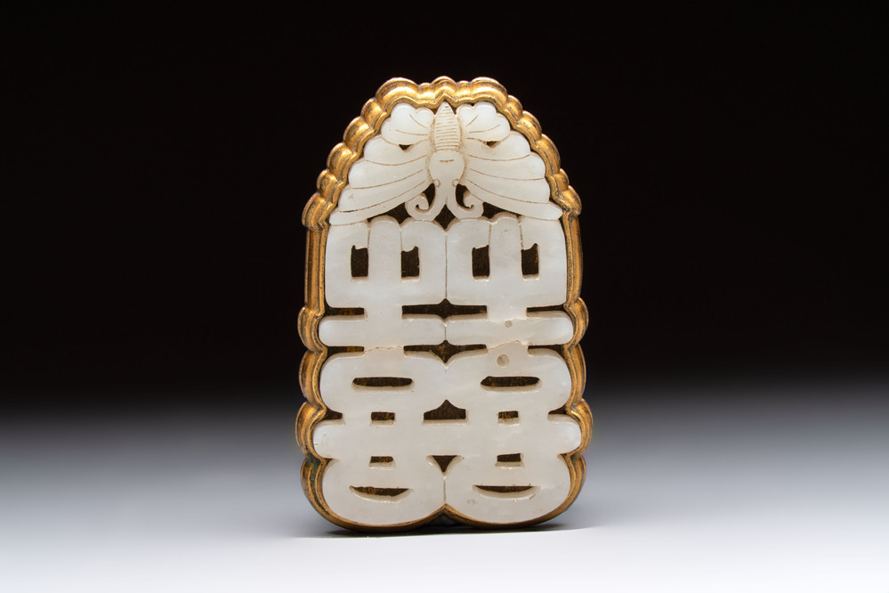A Chinese gilt bronze-mounted white jade 'double happiness' belt buckle, 18th C.