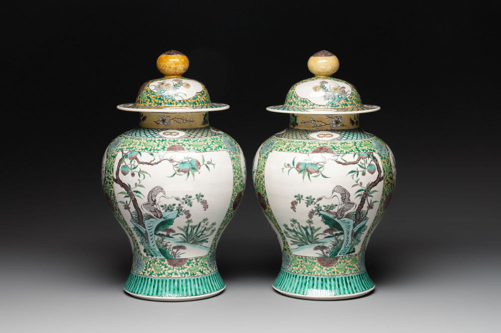 A pair of Chinese verte-biscuit 'cranes and flowers' vases and covers, 19th C.