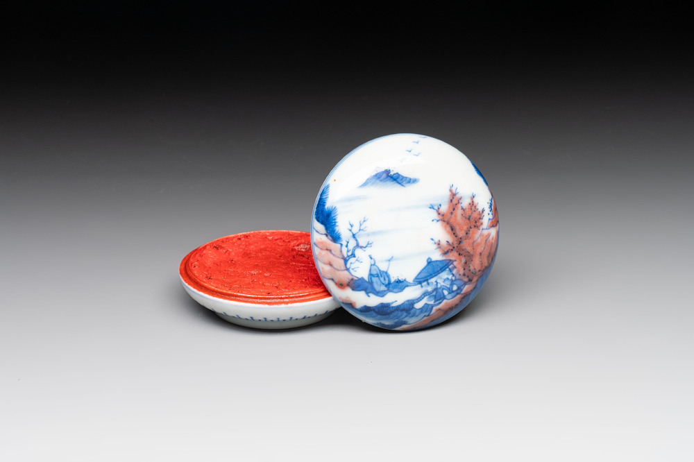 A fine Chinese blue, white and copper-red 'riverscape' seal paste box and cover, Kangxi mark, 19/20th C.