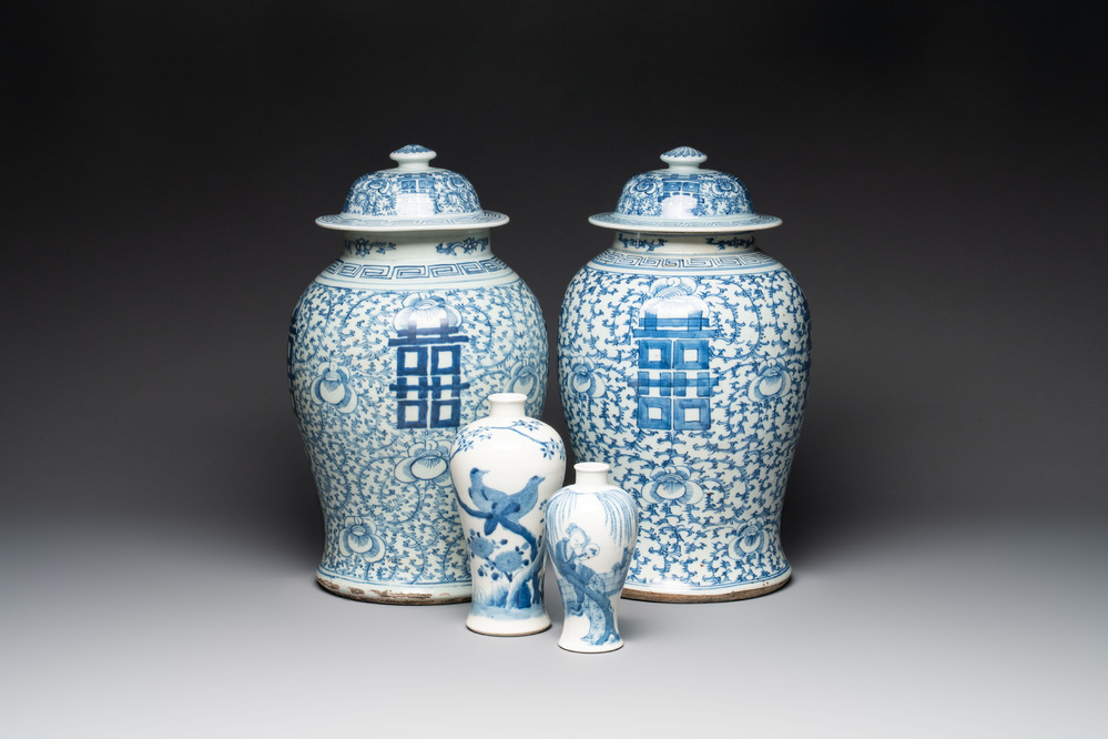 Two Chinese blue and white 'double happiness' covered vases and two 'meiping' vases, Kangxi mark, 19th C.