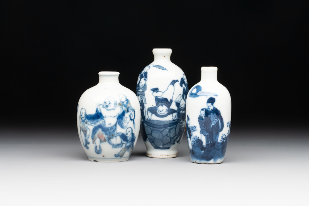 Three Chinese blue, white and copper-red snuff bottles with figural design, Yongzheng and Qianlong mark, 19th C.