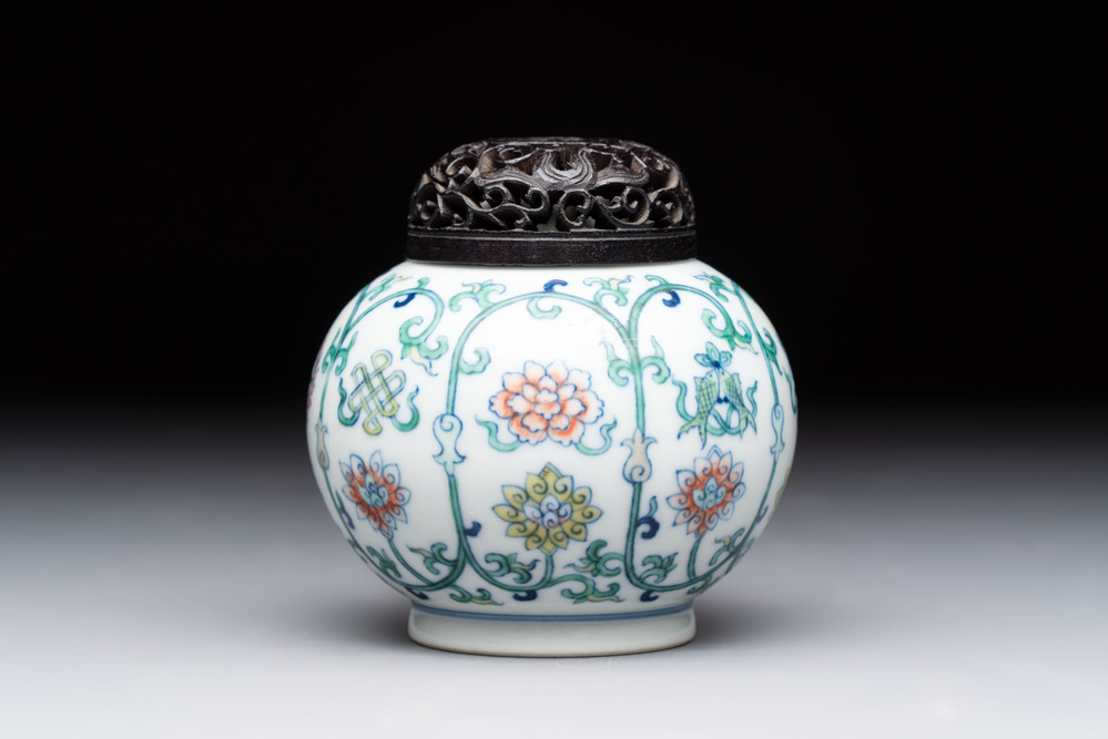 A Chinese doucai 'bajixiang' vase with a reticulated wooden cover, Yongzheng mark, 19/20th C.
