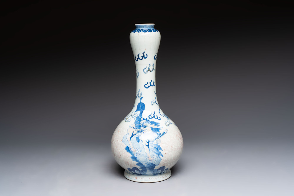 A Chinese blue, white and copper-red garlic-mouth vase with mythical animals, Kangxi mark, 19th C.