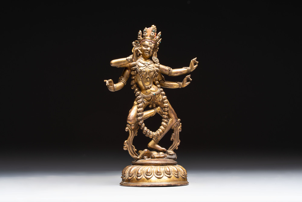 A Nepalese or Tibetan turquoise-inlaid gilt-bronze sculpture of Kurukulla or red Tara, 15th C. or later