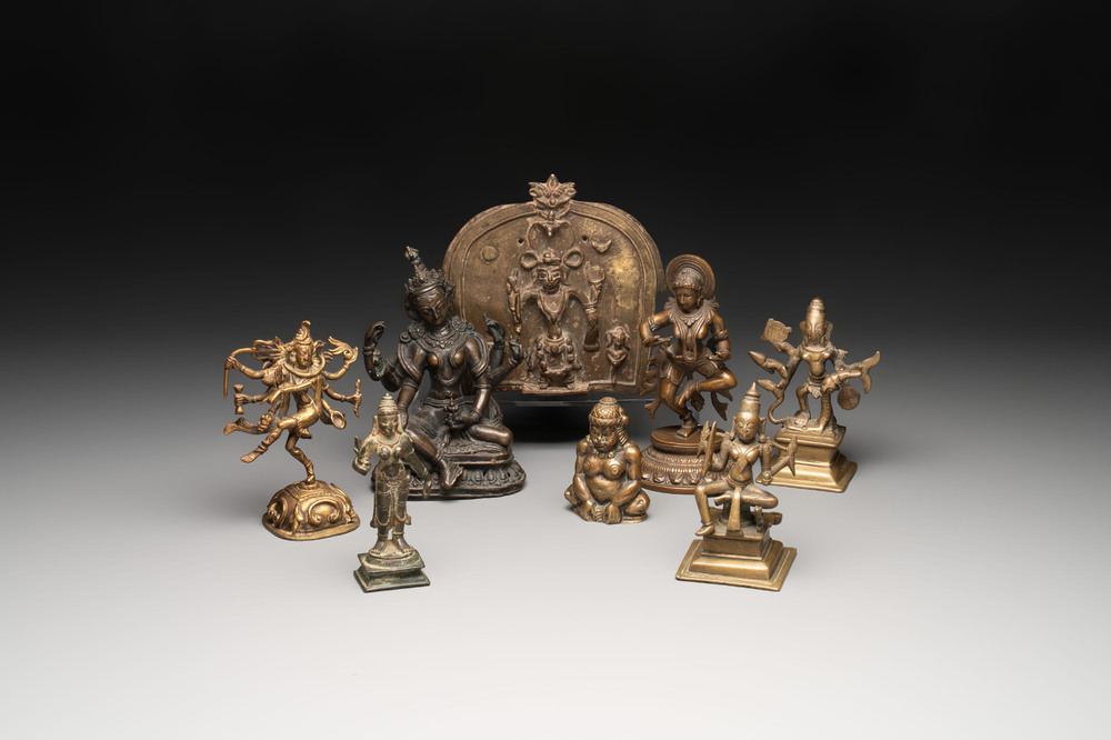 Seven bronze figures of deities and a religious relief plaque, India and Nepal, 18/19th C.