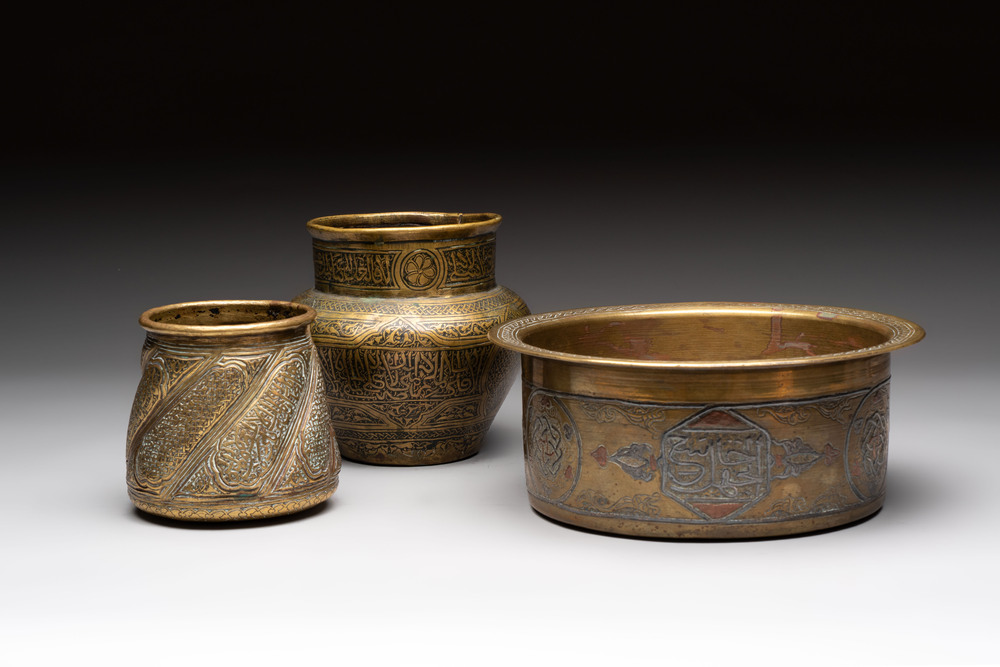Three 'calligraphic' brass vessels, Qajar, 19/20th C.