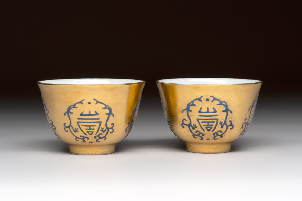 A pair of Chinese gilt-and blue-enamelled 'shou 壽' cups, Daoguang mark and possibly of the period
