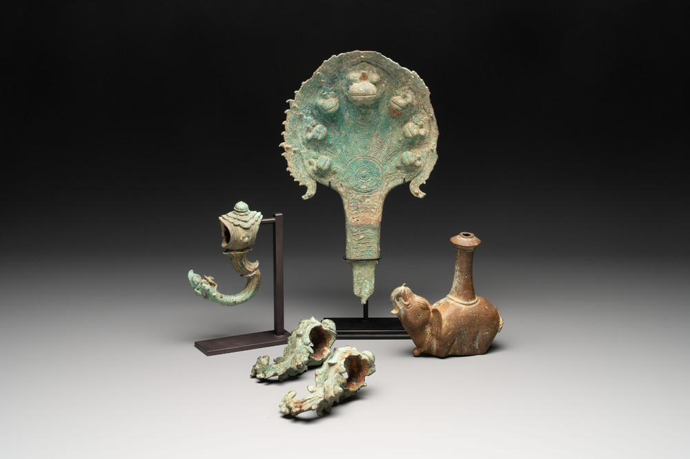 A collection of a bronze sculpture, three palanquin hooks and an elephant-form kendi, Cambodia, 13th C. and earlier