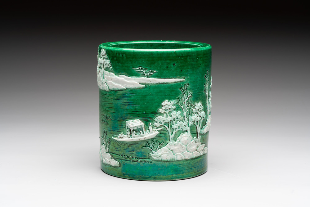 A Chinese verte biscuit 'riverscape' brush pot, artemisia leaf mark, 19th C.