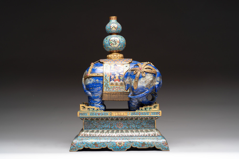 A Chinese lapis lazuli and cloisonn&eacute; elephant on stand, 19/20th C.