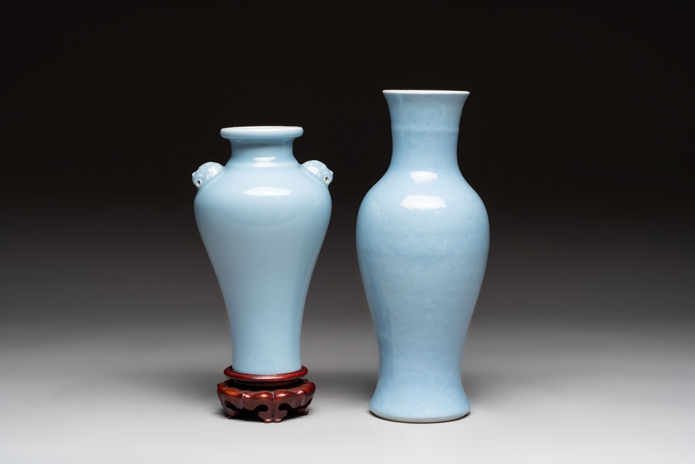 Two Chinese claire-de-lune vases, one with a wooden stand, Kangxi and Yongzheng mark, 19th C.