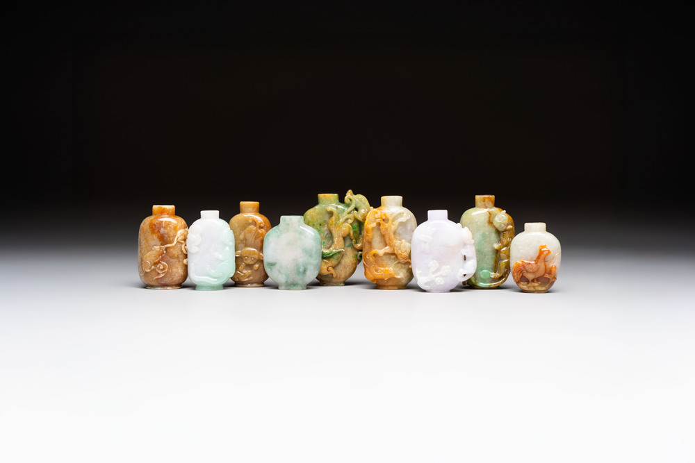 A group of nine Chinese jadeite snuff bottles, 20th C.