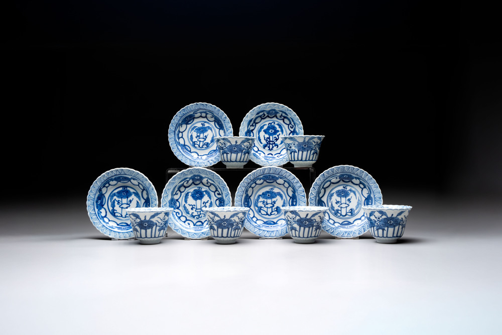 A set of six Chinese blue and white cups and saucers with floral design, Kangxi mark, 19th C.