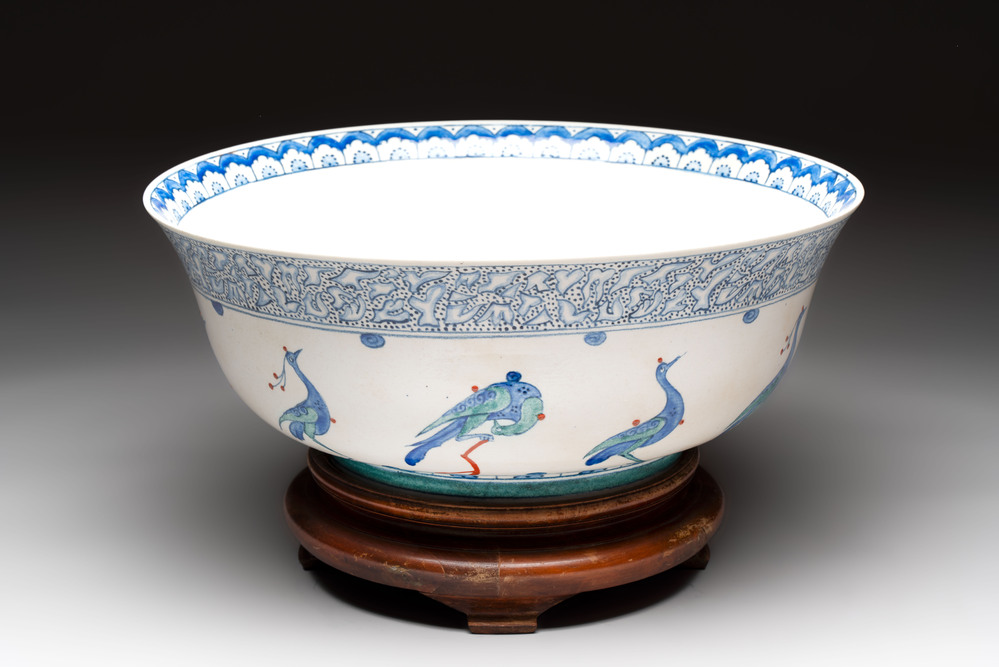 A large polychrome Iznik-style 'peacocks' bowl on a wooden stand, Samson, Paris, 19th C.
