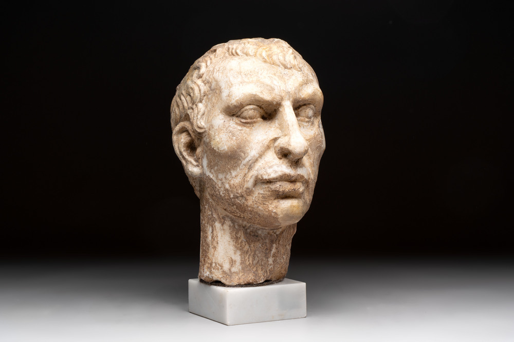 An Italian Grand Tour marble sculpture of a man's head in Roman style, probably after a bust of Caesar, 19th C.