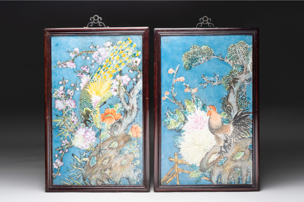 Two Chinese polychrome 'peacock' and 'rooster' plaques with wooden frames, 20th C.