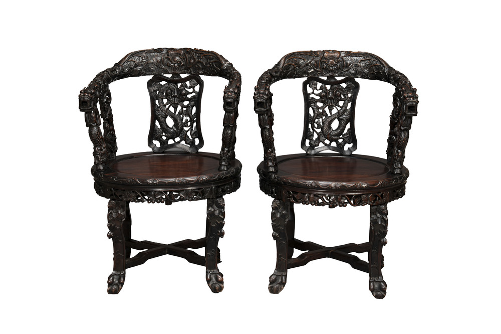 A pair of Chinese finely carved hongmu swivel chairs, Canton, 19th C.