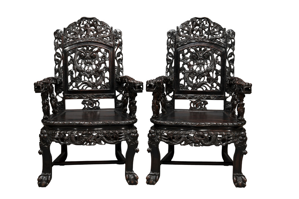 A pair of Chinese finely carved hongmu armchairs, Canton, 19th C.