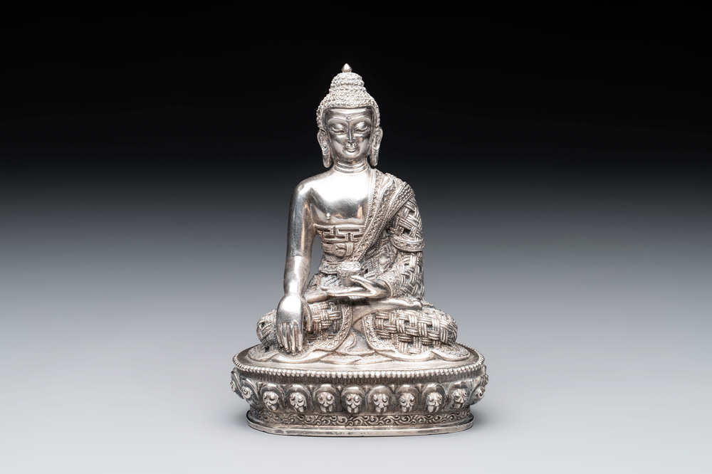 A fine Nepalese silver Buddha, 20th C.